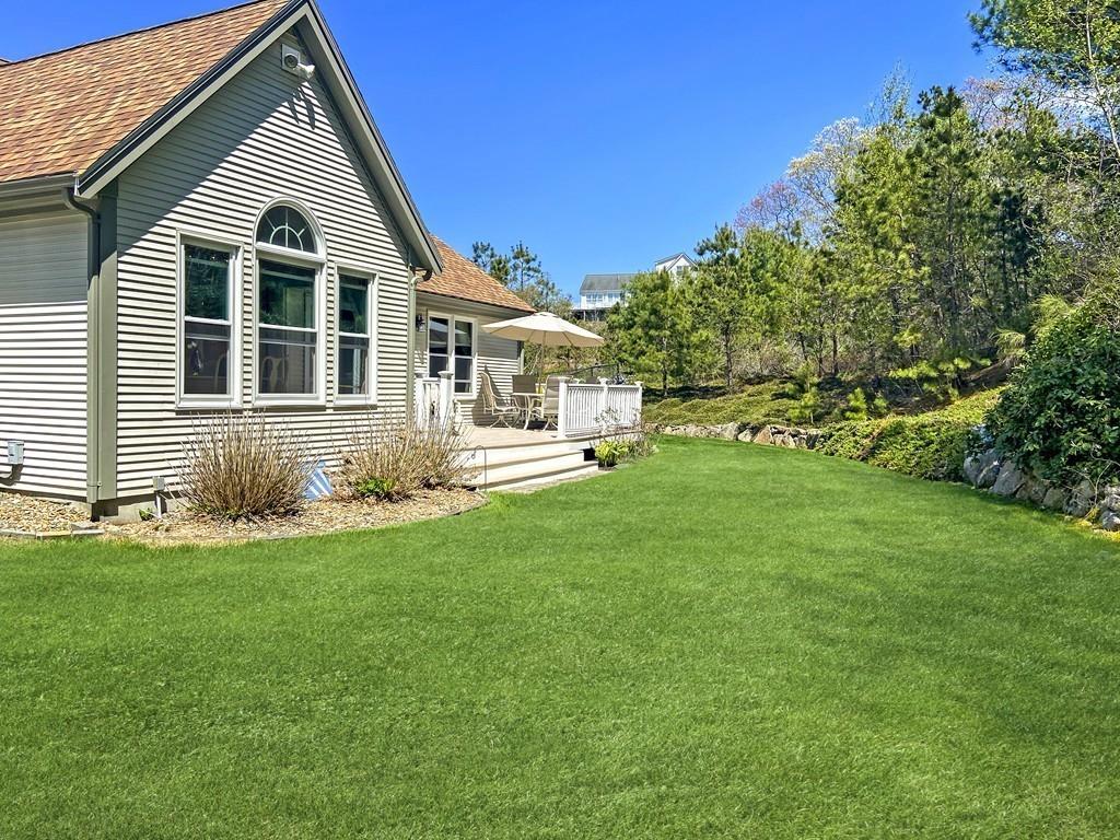 10 Weather Deck Road Bourne, MA 02532 - Photo 33 of 37 a front view of a house with a yard