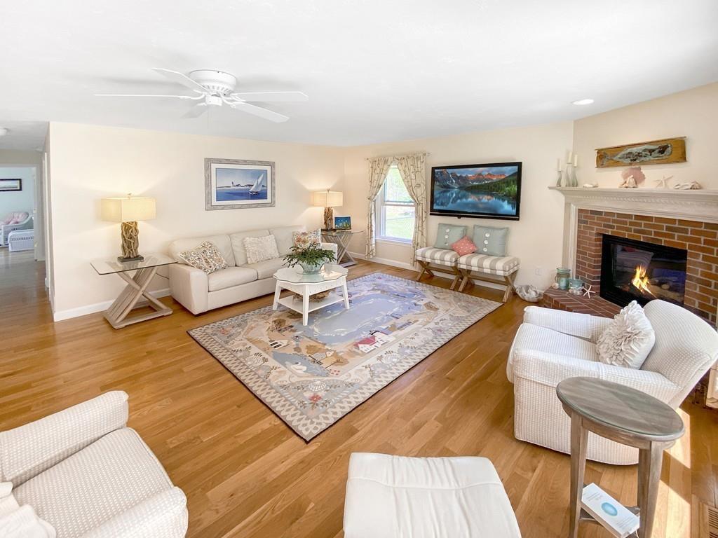 10 Weather Deck Road Bourne, MA 02532 - Photo 8 of 37 a living room with furniture and a fireplace