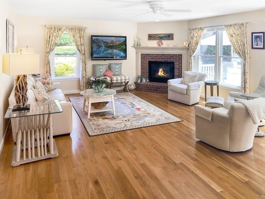 10 Weather Deck Road Bourne, MA 02532 - Photo 9 of 37 a living room with furniture fireplace and window