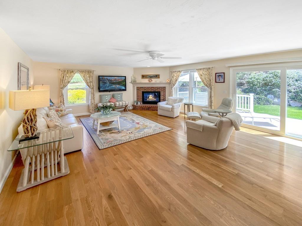 10 Weather Deck Road Bourne, MA 02532 - Photo 10 of 37 a living room with furniture and a fireplace