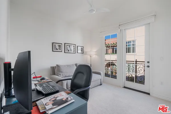 a workspace with furniture and window
