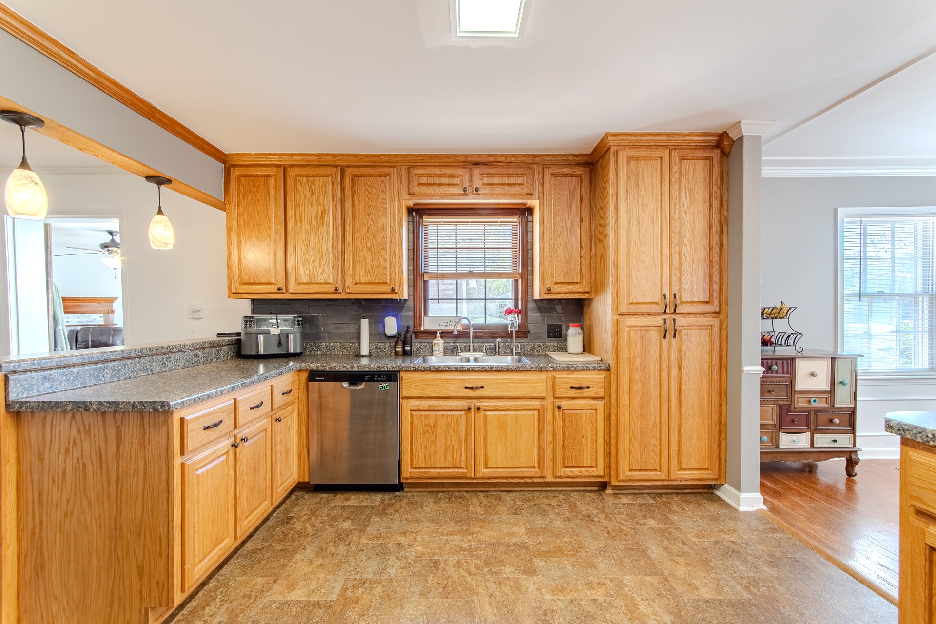 404 Highway 57 Ramer, TN 38367 - Photo 15 of 87 a kitchen with stainless steel appliances granite countertop a refrigerator and a stove top oven