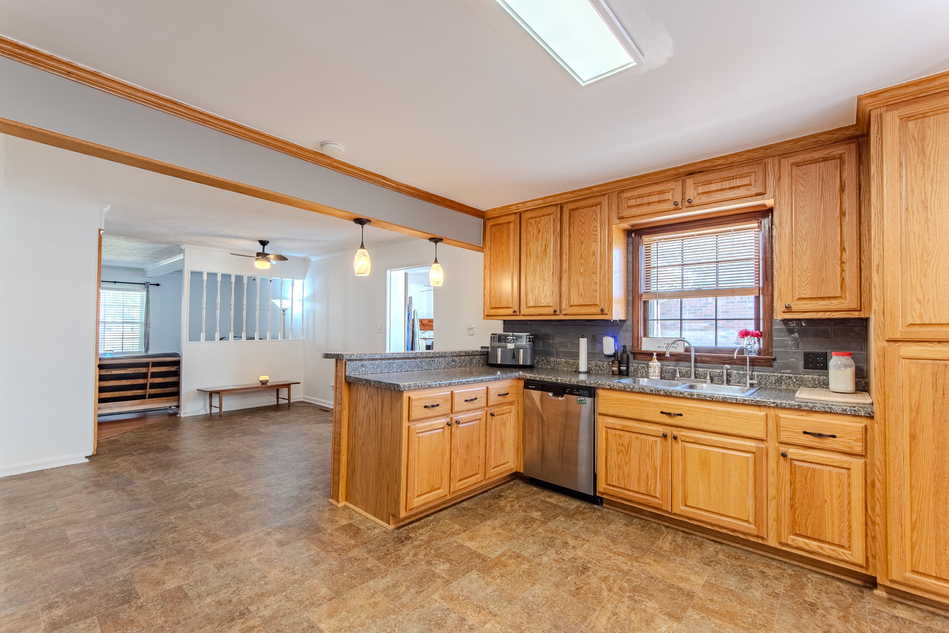 404 Highway 57 Ramer, TN 38367 - Photo 21 of 87 a kitchen with stainless steel appliances granite countertop a stove a sink and a refrigerator