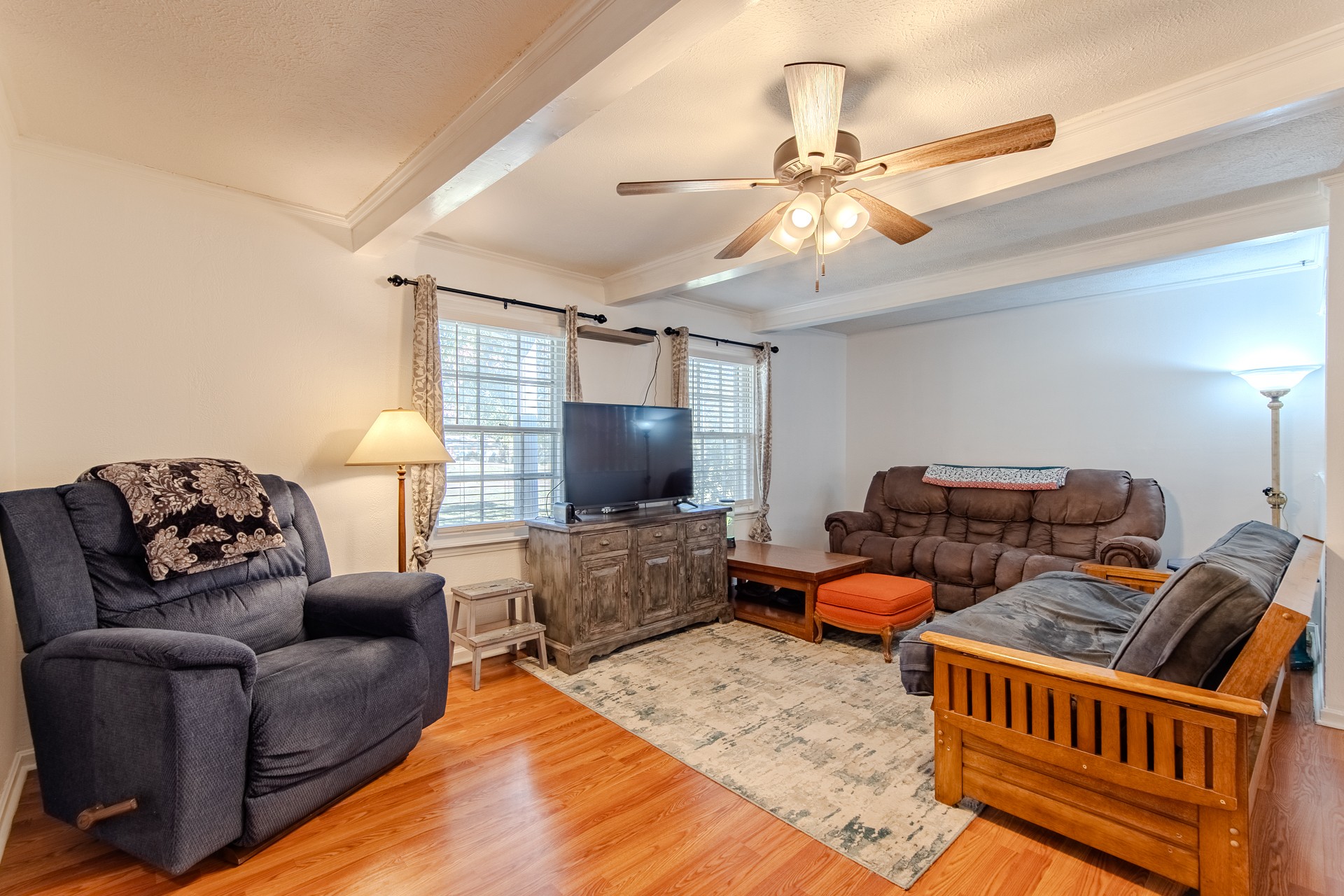 404 Highway 57 Ramer, TN 38367 - Photo 26 of 87 a living room with furniture a flat screen tv and a chandelier