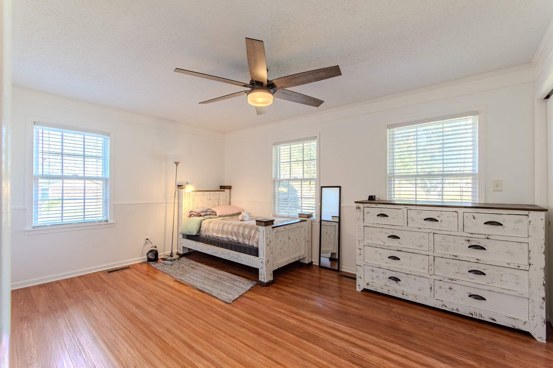 404 Highway 57 Ramer, TN 38367 - Photo 30 of 87 a bedroom with a bed and a dresser in it