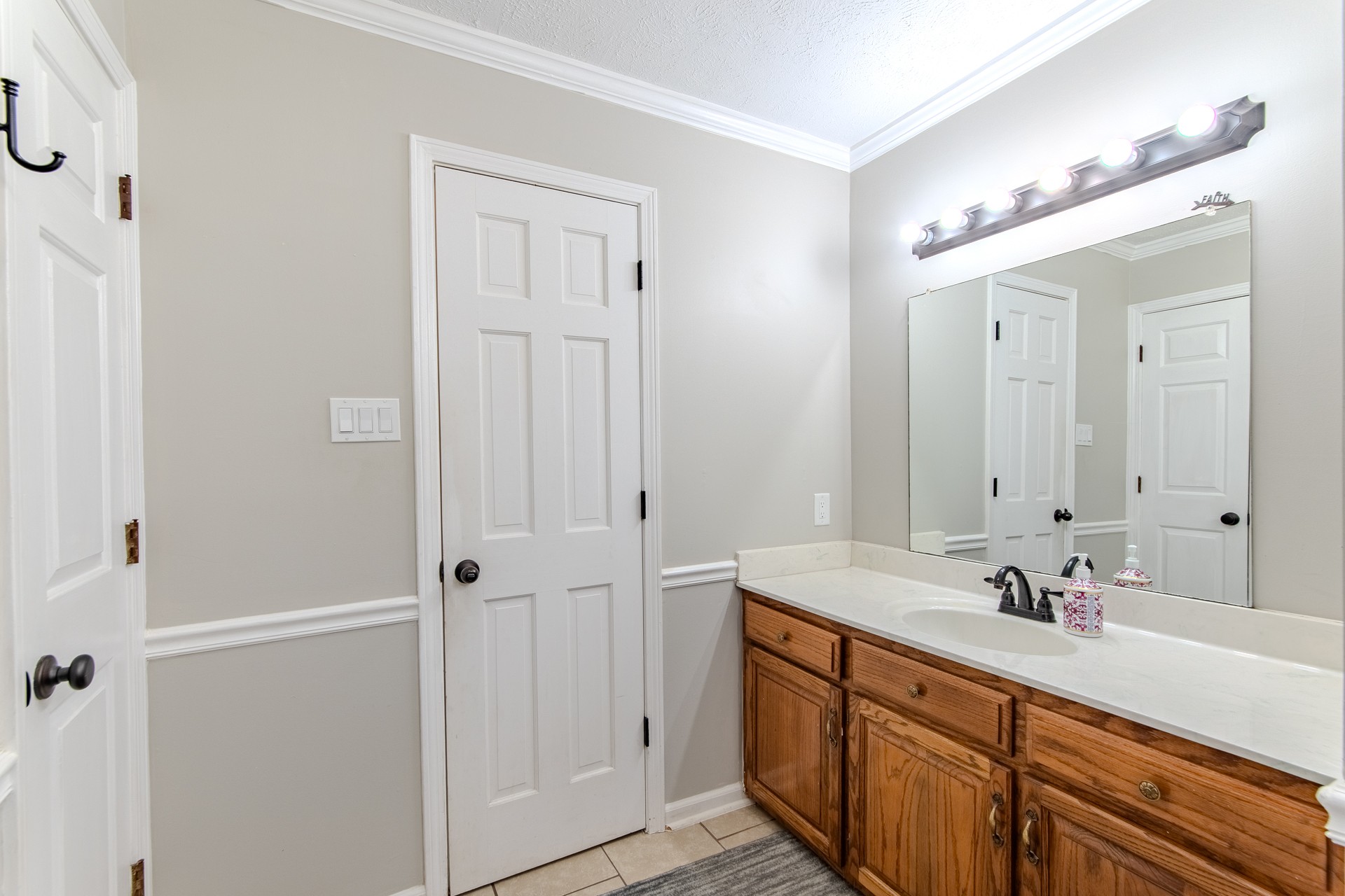 404 Highway 57 Ramer, TN 38367 - Photo 34 of 87 a spacious bathroom with a double vanity sink a mirror and a shower