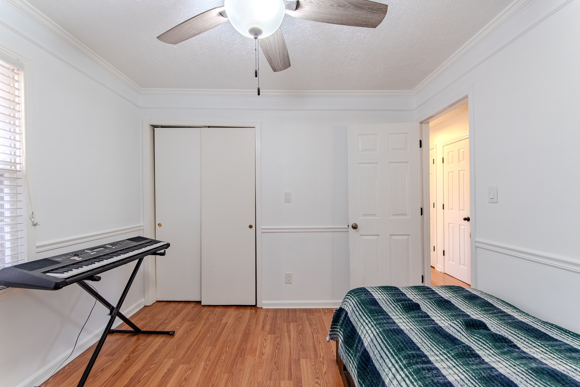 404 Highway 57 Ramer, TN 38367 - Photo 36 of 87 a bedroom with a bed and wooden floor