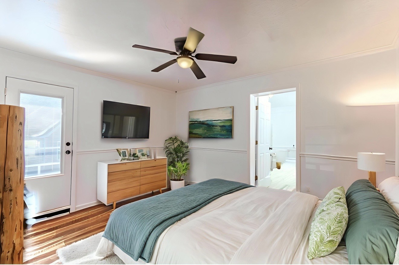 404 Highway 57 Ramer, TN 38367 - Photo 37 of 87 a bedroom with a bed and a flat screen tv