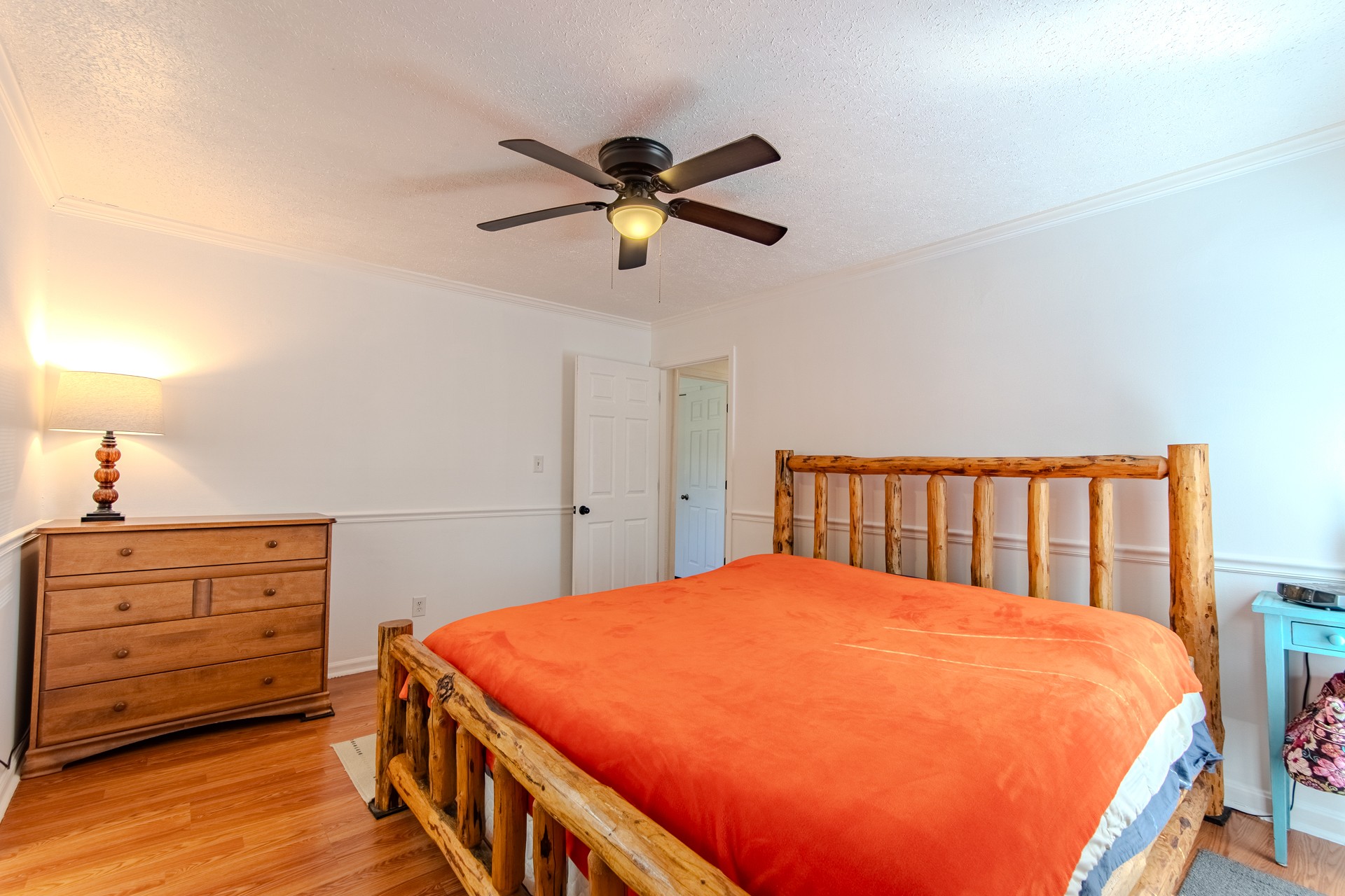 404 Highway 57 Ramer, TN 38367 - Photo 38 of 87 a bedroom with a bed and a chandelier