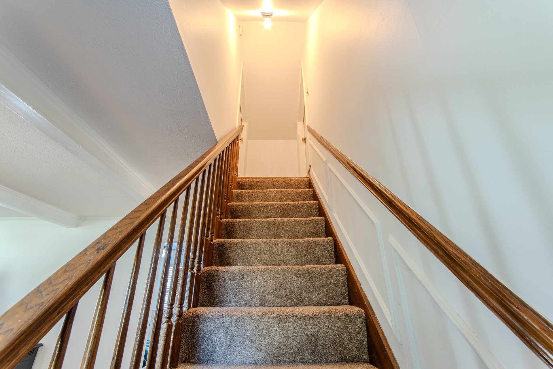 404 Highway 57 Ramer, TN 38367 - Photo 45 of 87 a view of staircase with wooden floor and white walls
