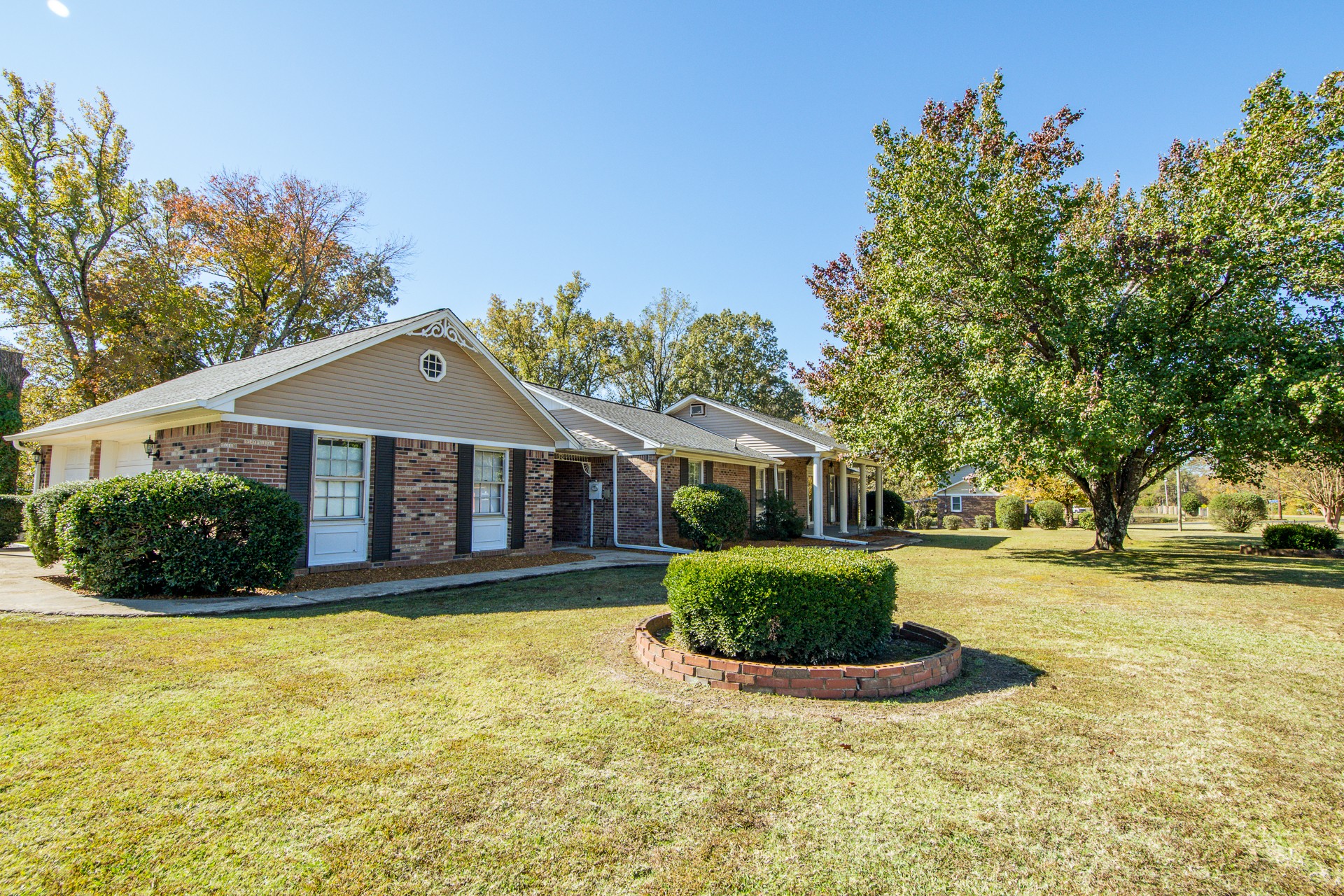 404 Highway 57 Ramer, TN 38367 - Photo 70 of 87 a front view of a house with a yard garage and outdoor seating