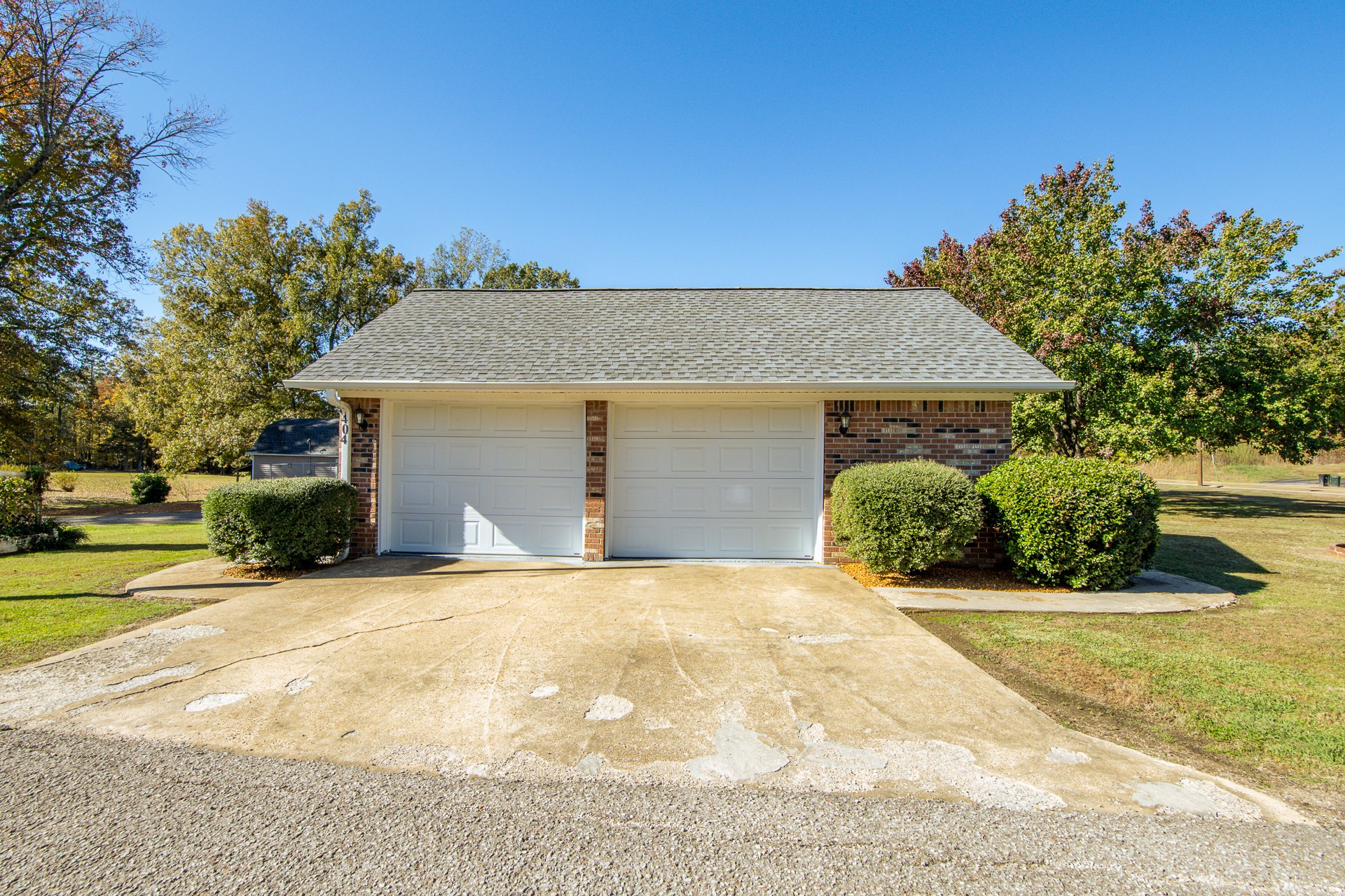 404 Highway 57 Ramer, TN 38367 - Photo 7 of 87 a front view of a house with a yard and garage