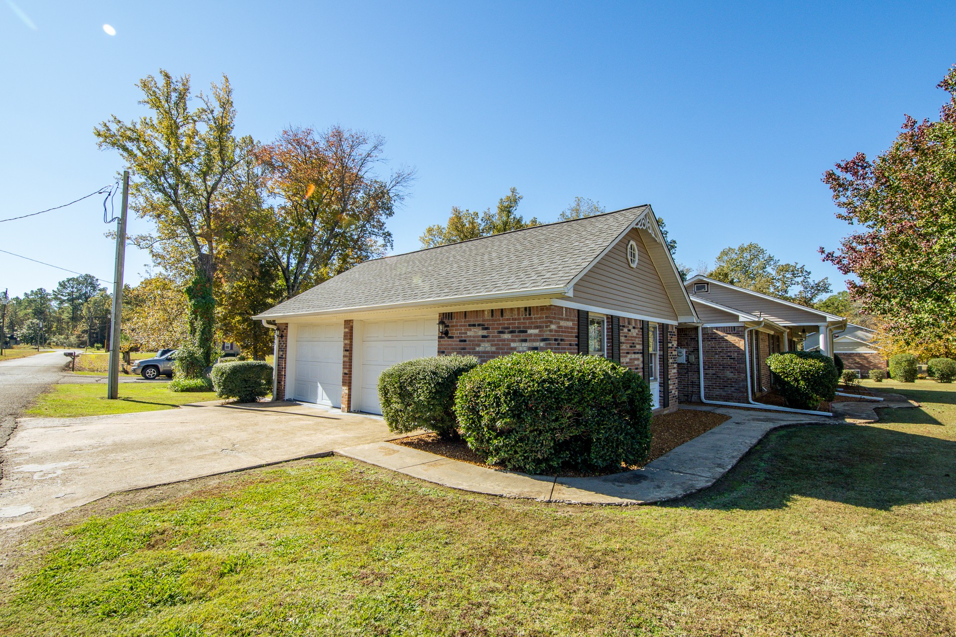 404 Highway 57 Ramer, TN 38367 - Photo 74 of 87 a front view of a house with a yard and potted plants