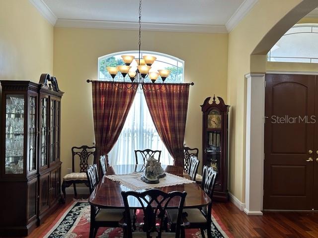 17127 Brown Road Odessa, FL 33556 - Photo 11 of 58 a view of a dining room with furniture wooden floor and chandelier