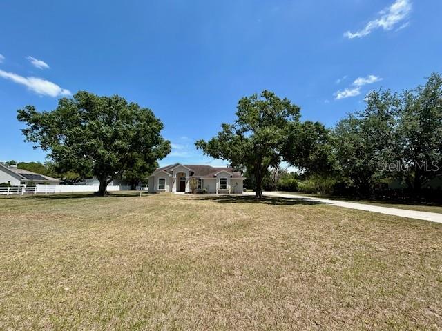 17127 Brown Road Odessa, FL 33556 - Photo 2 of 58 a house with trees in the background
