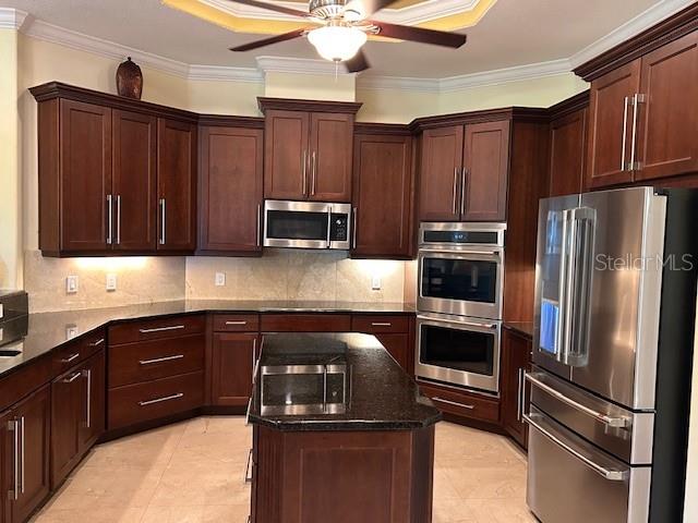17127 Brown Road Odessa, FL 33556 - Photo 22 of 58 a kitchen with stainless steel appliances granite countertop a refrigerator and a sink
