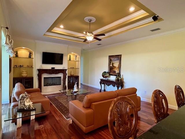 17127 Brown Road Odessa, FL 33556 - Photo 31 of 58 a living room with furniture a fireplace and a flat screen tv