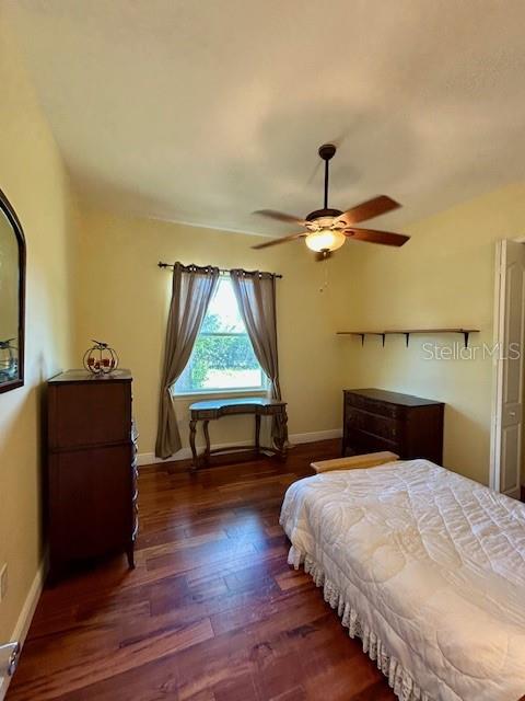 17127 Brown Road Odessa, FL 33556 - Photo 37 of 58 a bedroom with a bed and a table