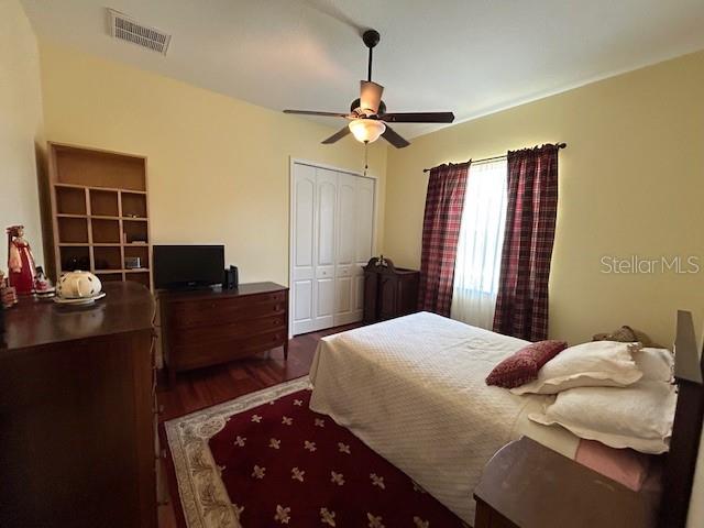 17127 Brown Road Odessa, FL 33556 - Photo 41 of 58 a bedroom with a bed and a chandelier