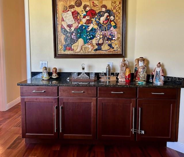 17127 Brown Road Odessa, FL 33556 - Photo 55 of 58 a room with a painting on the wall and a potted plant