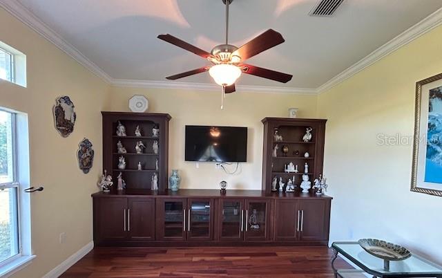 17127 Brown Road Odessa, FL 33556 - Photo 57 of 58 a living room with furniture and a flat screen tv