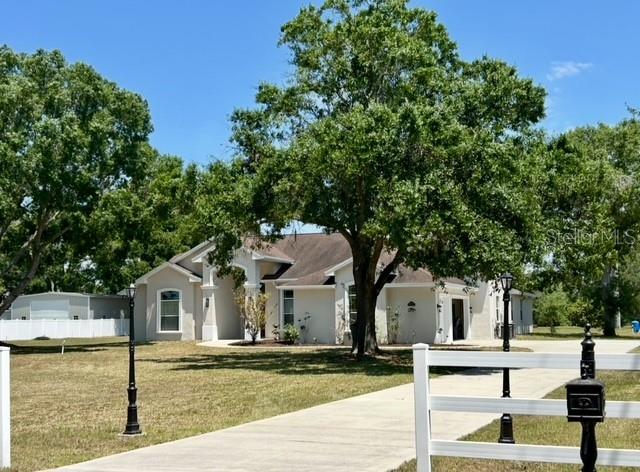 17127 Brown Road Odessa, FL 33556 - Photo 58 of 58 a front view of a house with a garden