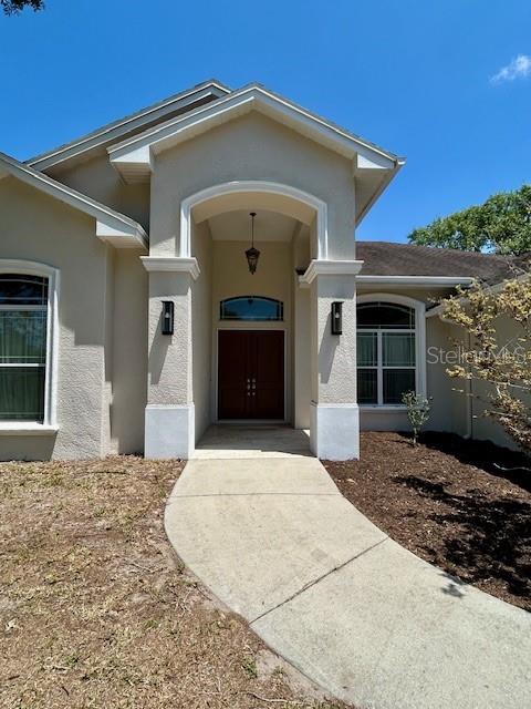17127 Brown Road Odessa, FL 33556 - Photo 6 of 58 a front view of a house with a yard
