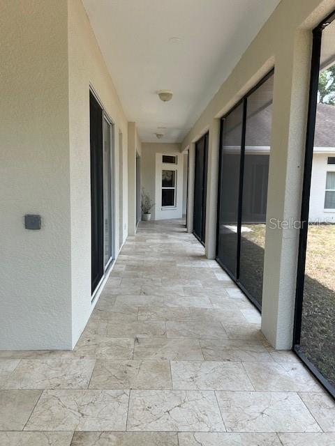 17127 Brown Road Odessa, FL 33556 - Photo 7 of 58 a view of a hallway with wooden shelves