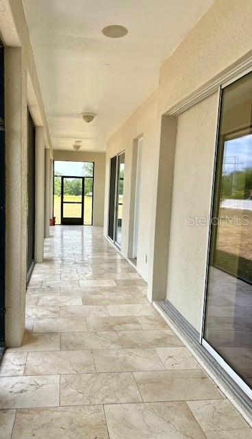 17127 Brown Road Odessa, FL 33556 - Photo 8 of 58 a view of an entryway with wooden floor and door