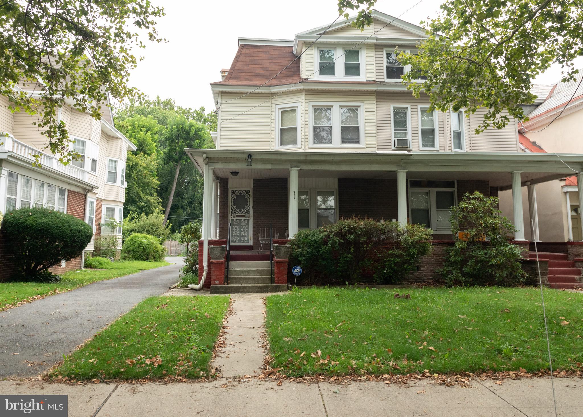 1206 West State Street Trenton, NJ 08618 - Photo 1 of 14 a front view of a house with garden