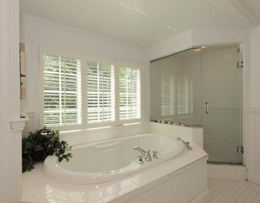 118 Pembroke Road Darien, CT 06820 - Photo 12 of 18 a bath tub sitting in a bathroom next to a window