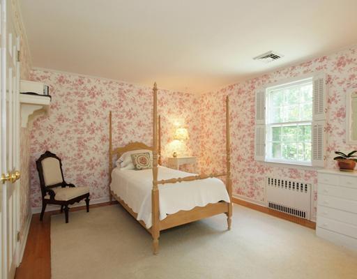 118 Pembroke Road Darien, CT 06820 - Photo 13 of 18 a bedroom with a bed and a window