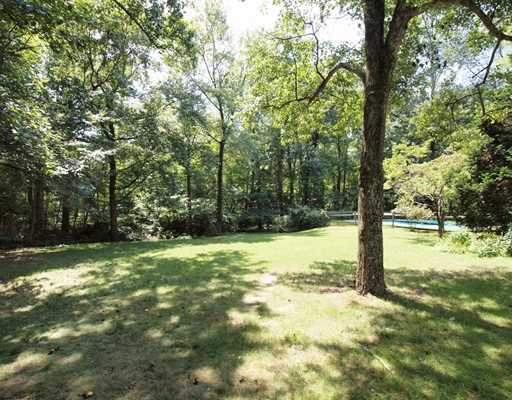 118 Pembroke Road Darien, CT 06820 - Photo 16 of 18 a view of a yard with trees