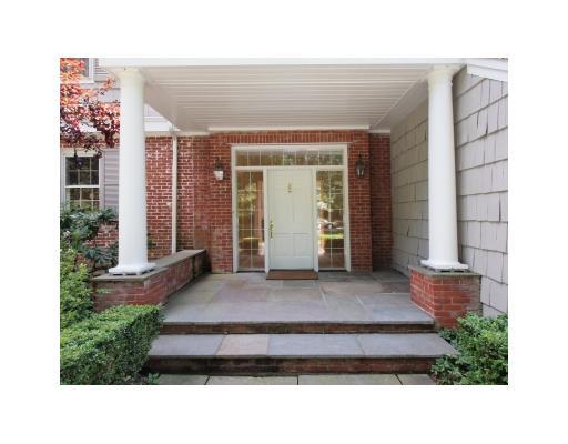 118 Pembroke Road Darien, CT 06820 - Photo 2 of 18 a front view of a house with a yard