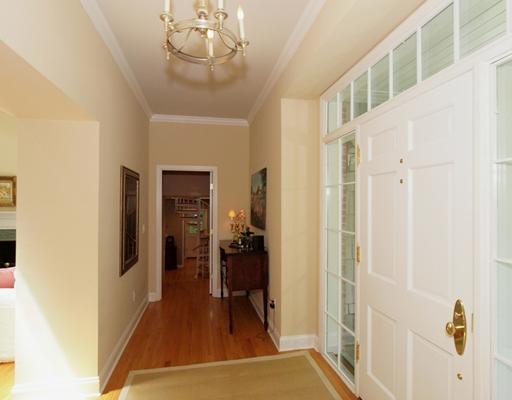 118 Pembroke Road Darien, CT 06820 - Photo 3 of 18 a view of a hallway with wooden floor and staircase