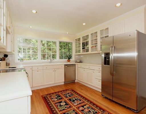 118 Pembroke Road Darien, CT 06820 - Photo 6 of 18 a kitchen with a refrigerator stove and sink