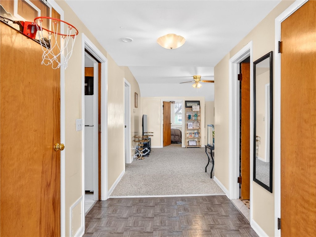 79 Arvine Heights Rochester, NY 14611 - Photo 26 of 34 Wide long hallway to DINING ROOM, overlooking back