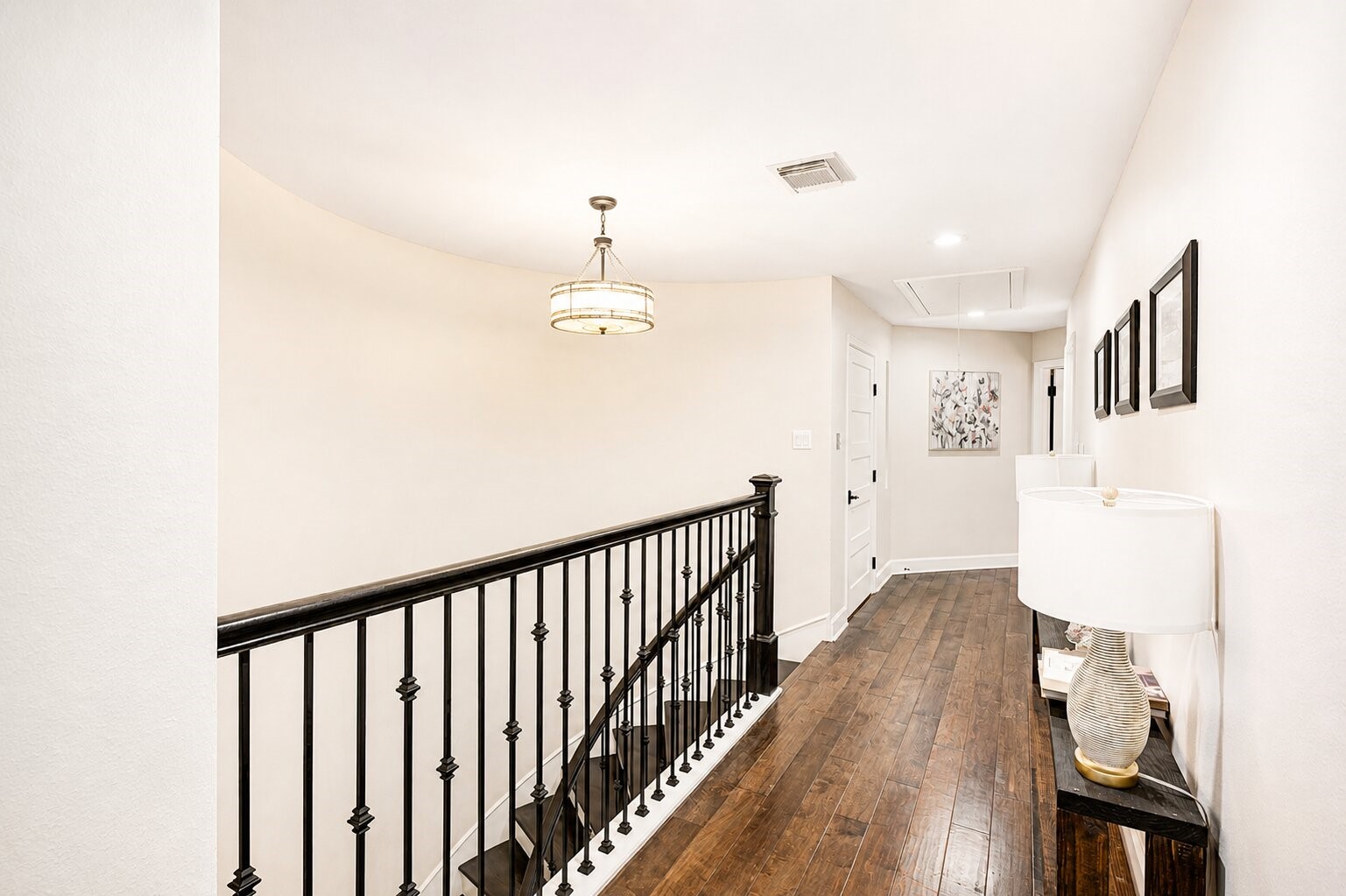 201 Vanderpool Lane, Unit 130 Houston, TX 77024 - Photo 21 of 41 The landing mimics the gallery below- serving as a 'spine' that connects both upper wings of the residence and includes access to two closets.