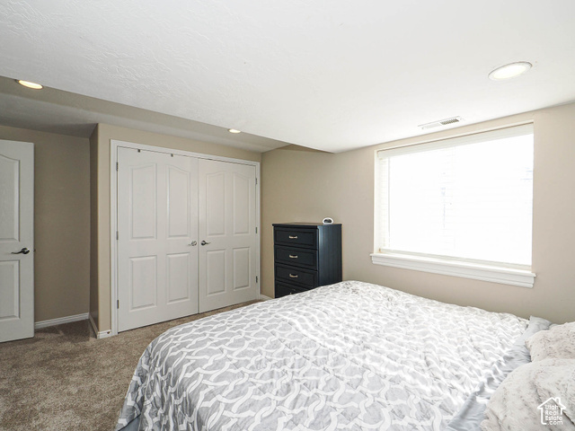 11779 South Stone Ridge Court Ridge West Riverton, UT 84065 - Photo 63 of 85 Recessed lighting, window with blinds, bi-fold closet doors, wall-to-wall carpeting, and a white interior door