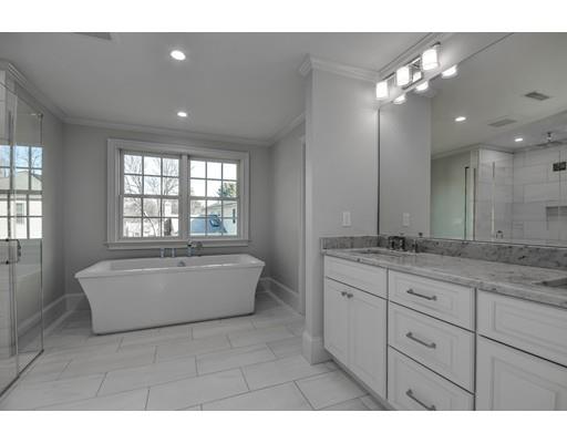 20 Mellon Road Wellesley, MA 02482 - Photo 16 of 25 a bathroom with a granite countertop bathtub a sink and a large mirror