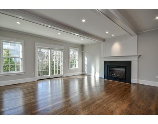 20 Mellon Road Wellesley, MA 02482 - Photo 8 of 25 a view of an empty room with wooden floor fireplace and a window