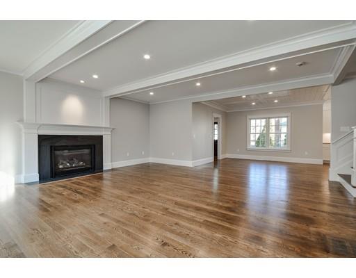 20 Mellon Road Wellesley, MA 02482 - Photo 9 of 25 a view of an empty room with wooden floor and a fireplace