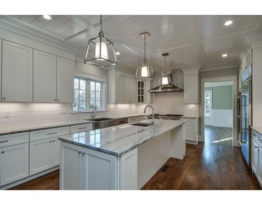 20 Mellon Road Wellesley, MA 02482 - Photo 10 of 25 a kitchen with stainless steel appliances a sink stove and cabinets