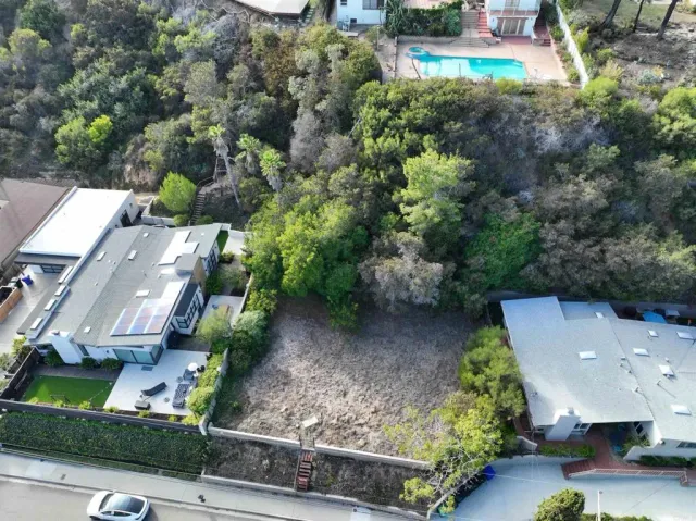 an aerial view of a house with outdoor space