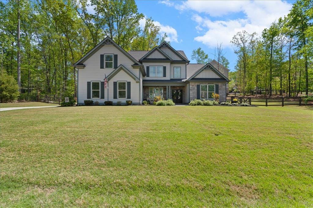 7610 Scenic Overlook Cumming, GA 30041 - Photo 6 of 62 a front view of a house with a yard