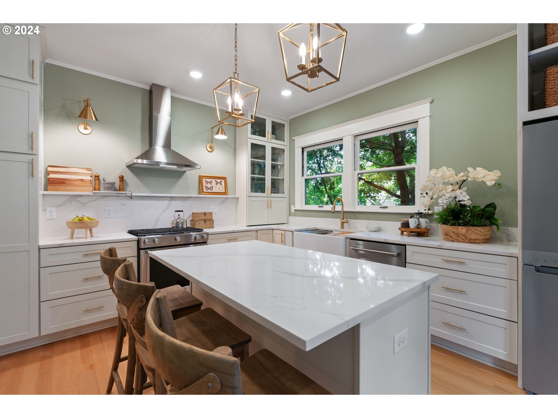 2548 Southwest St Helens Court Portland, OR 97201 - Photo 11 of 42 a kitchen with a table chairs stove and cabinets