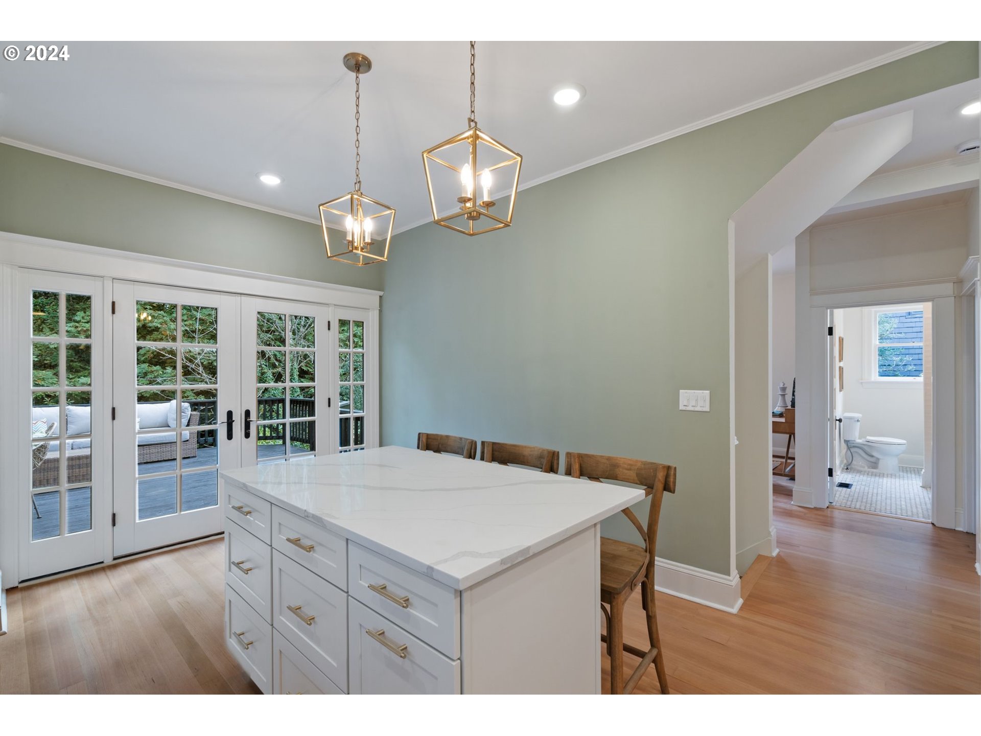 2548 Southwest St Helens Court Portland, OR 97201 - Photo 17 of 42 a kitchen that has a lot of cabinets and wooden floor