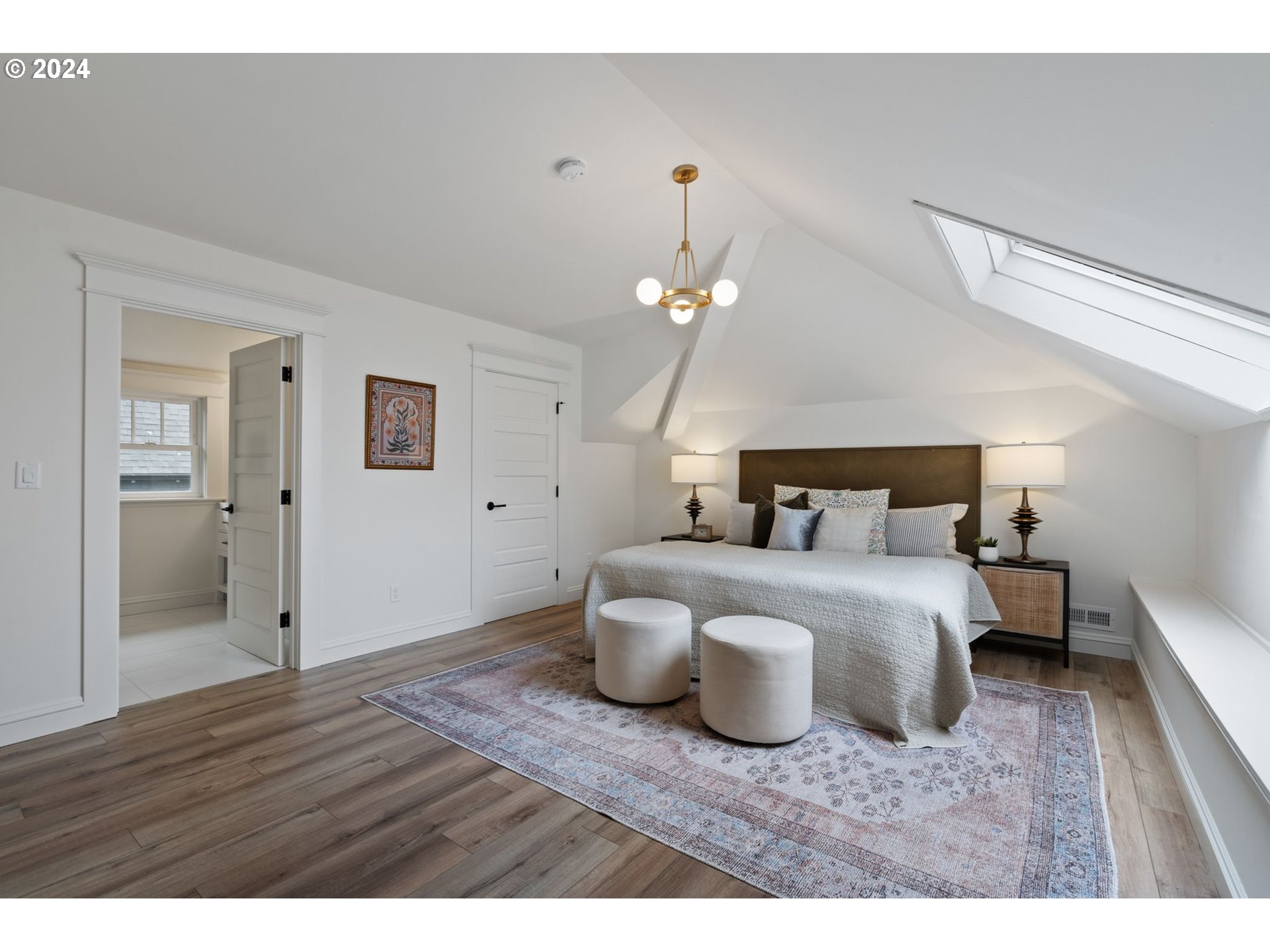 2548 Southwest St Helens Court Portland, OR 97201 - Photo 21 of 42 a bedroom with a bed and wooden floor