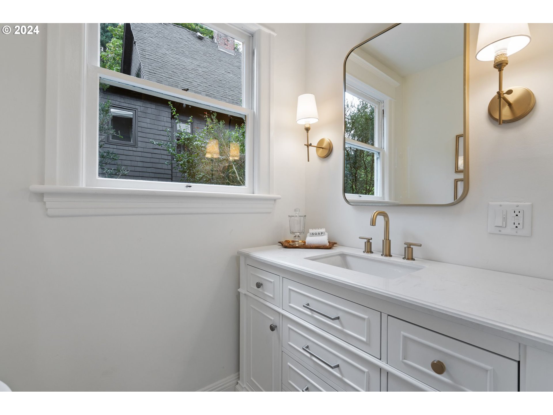 2548 Southwest St Helens Court Portland, OR 97201 - Photo 27 of 42 a bathroom with a sink and a mirror