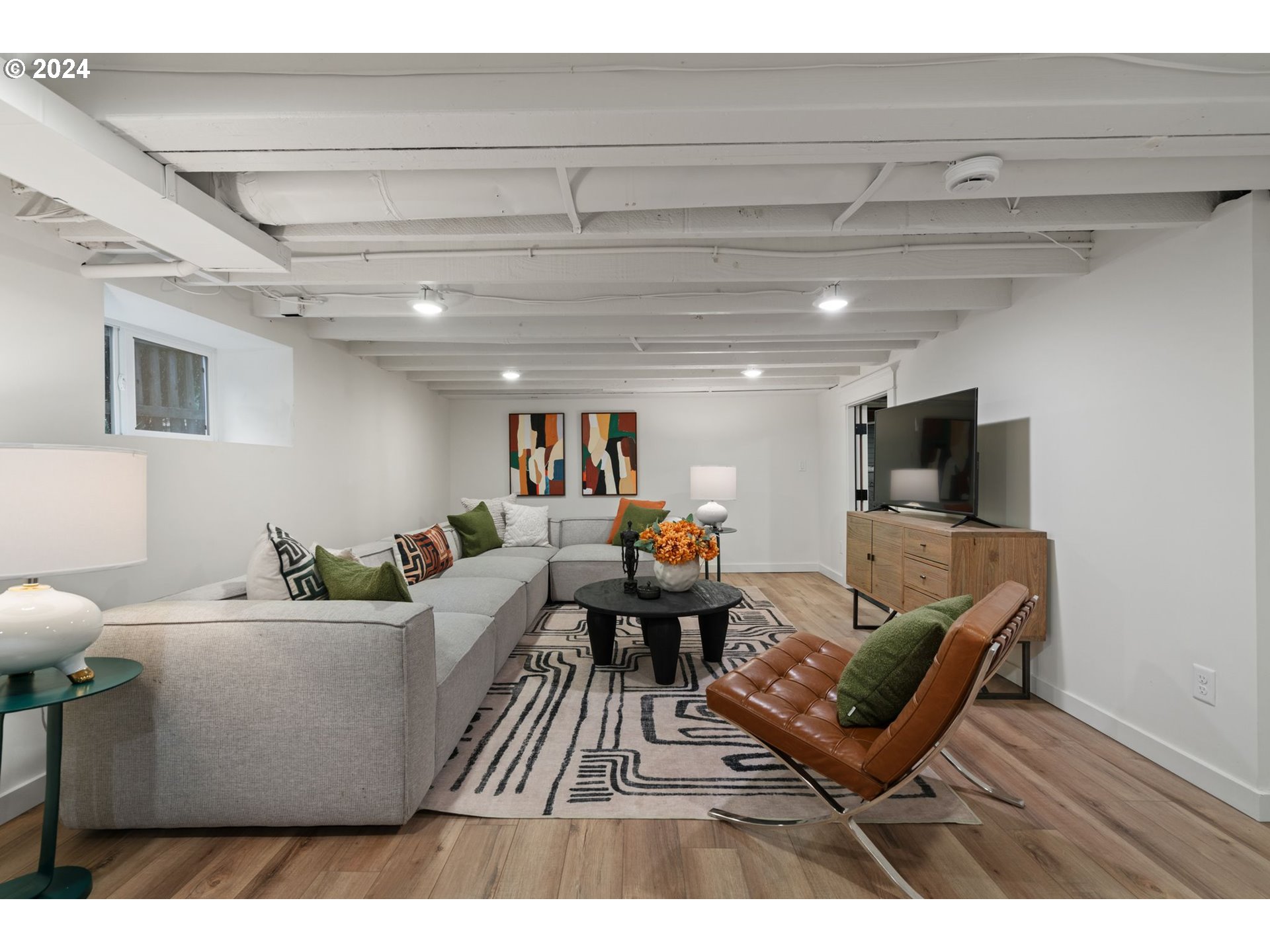 2548 Southwest St Helens Court Portland, OR 97201 - Photo 31 of 42 a living room with furniture and a flat screen tv